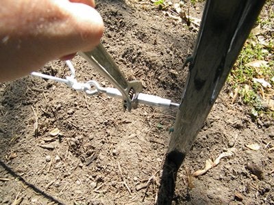 Snug the Clothesline Up Using the Turnbuckle and a Wrench